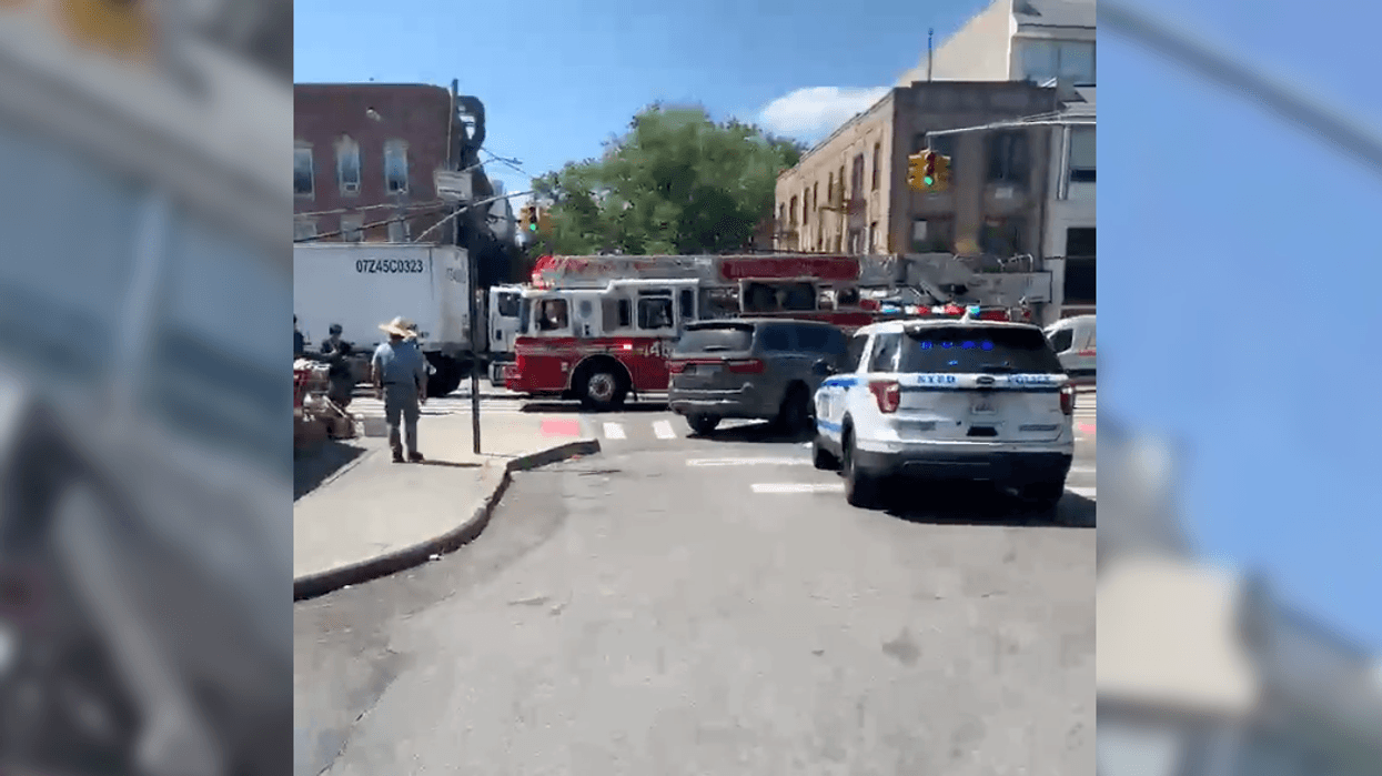 Police and EMS at the scene of the fatal crash on Fort Hamilton Parkway in Borough Park on Thursday afternoon