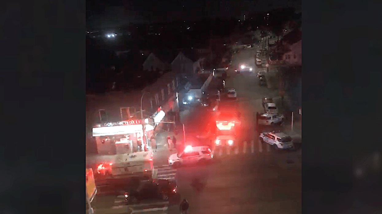 Police and EMS at the scene of the stabbing in Jamaica around 6:30 p.m. Monday