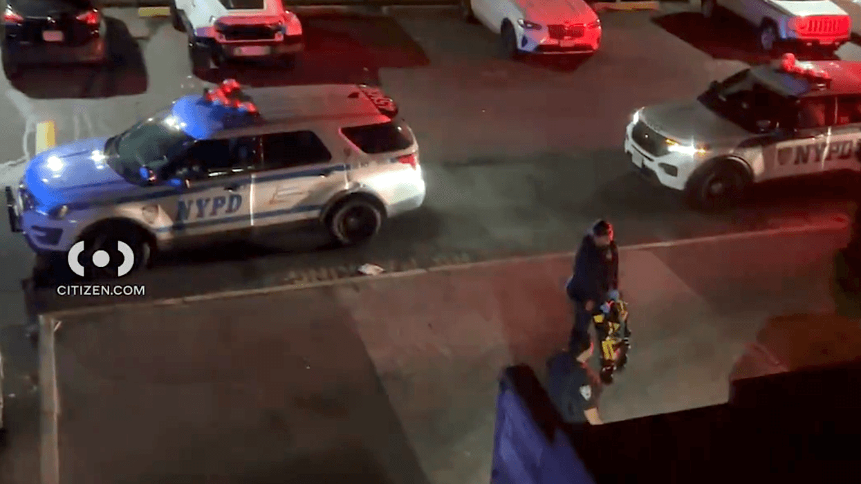 Police and EMS respond to the shooting at 319 Beach 54th St. on Thursday night