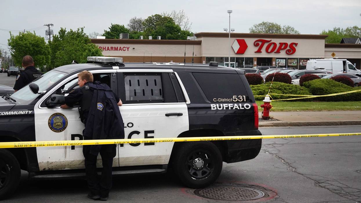 Police and FBI agents investigating the shooting at Tops Market on May 16, 2022 in Buffalo, New York.