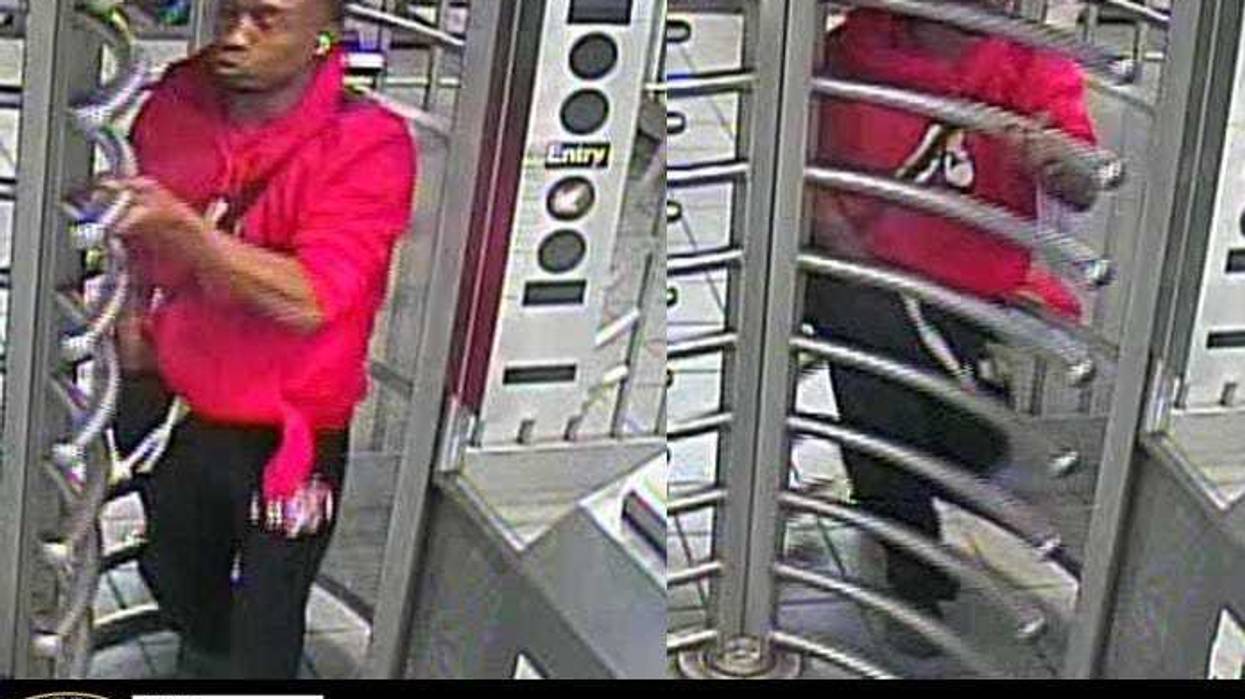Police are searching for a man accused of punching another man in the face in an unprovoked attack at a Queens subway station over the weekend.