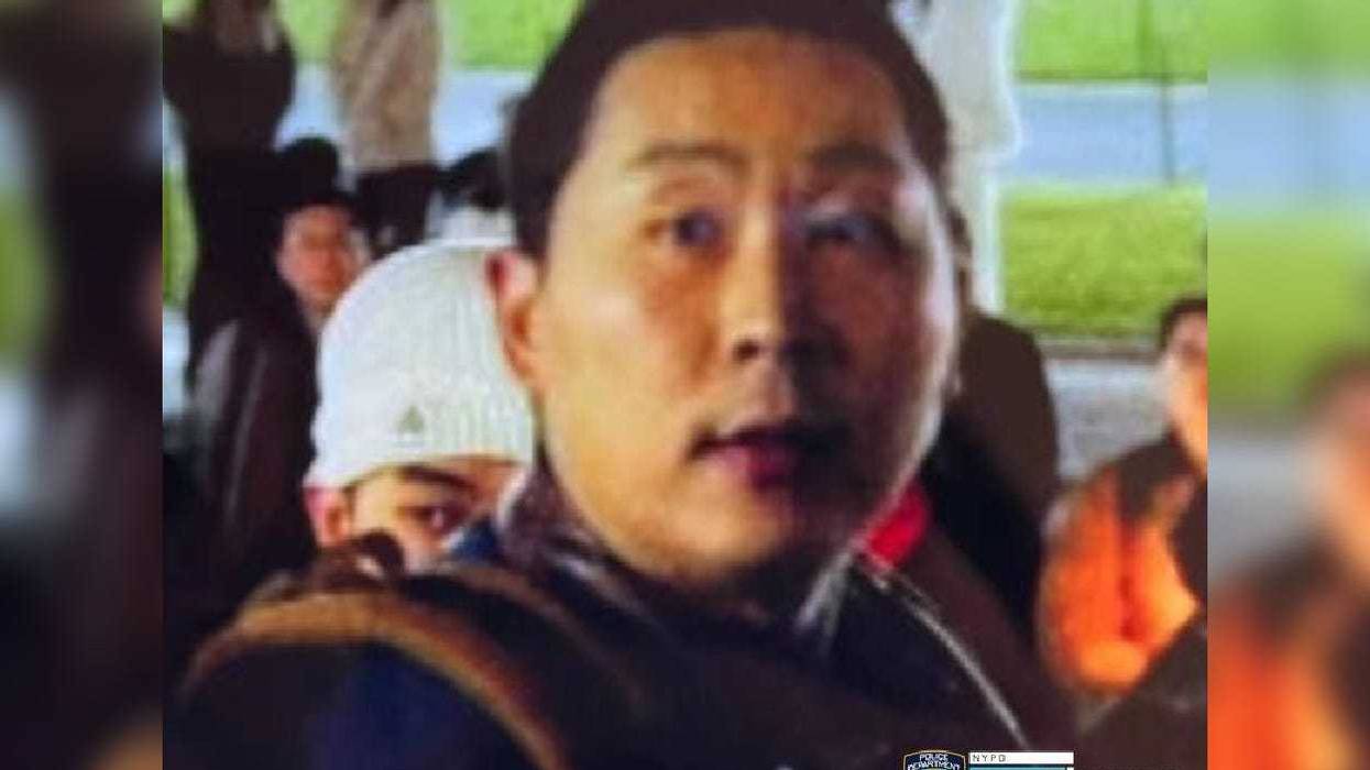 Police are searching for a man they say pummeled a woman unconscious at a Columbia University protest over China's COVID-19 rules