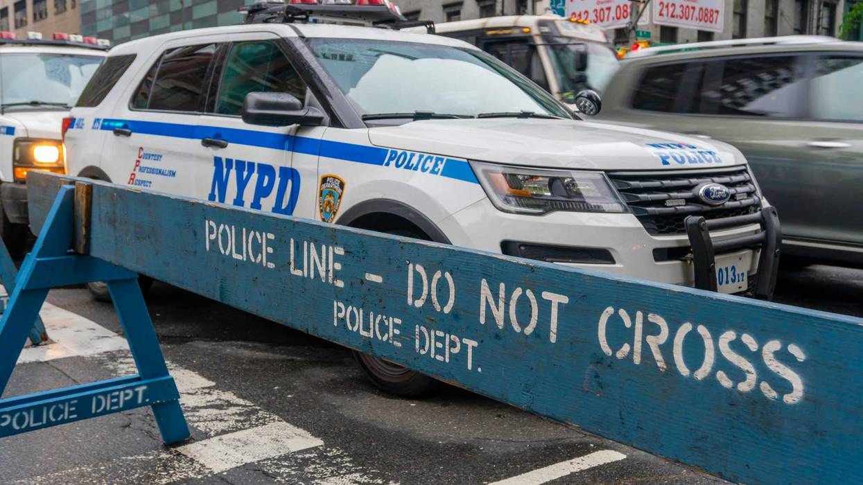 Police are searching for a mna who crashed into two pedestrians on a Queens street early Sunday morning while fleeing a traffic stop.
