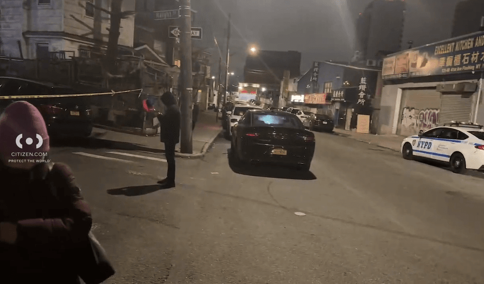 Police are seen at the shooting scene