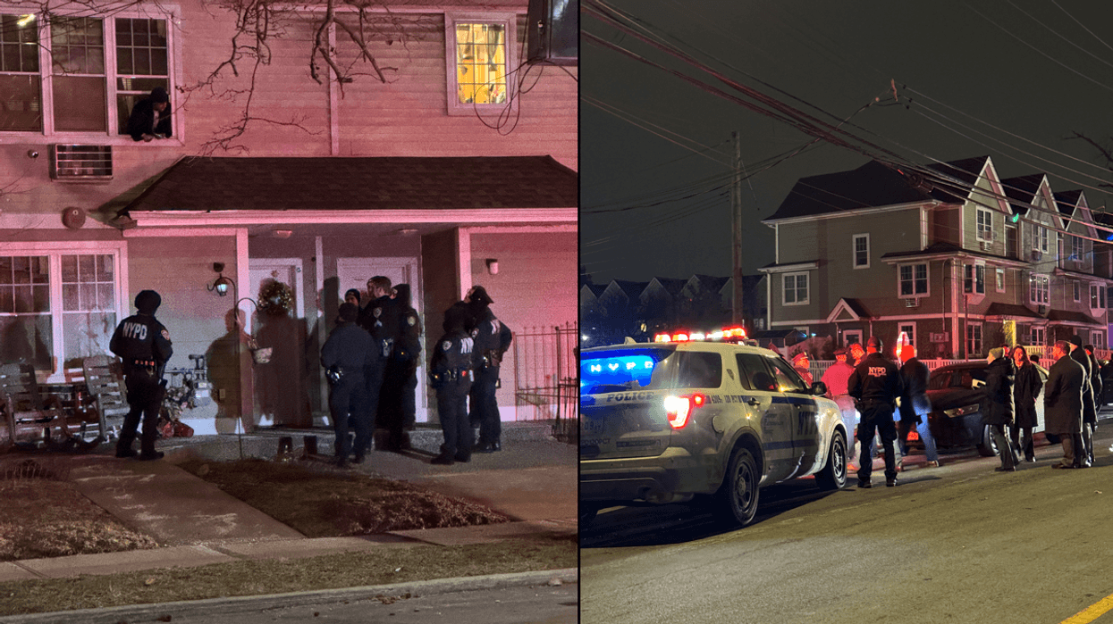 Police are seen investigating in West Brighton on Thursday evening