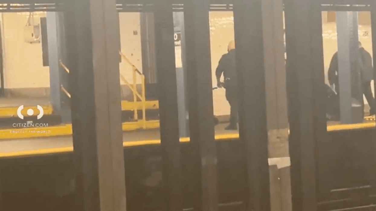 Police are seen on a C platform at the 50th Street station after the attack on Dec. 30