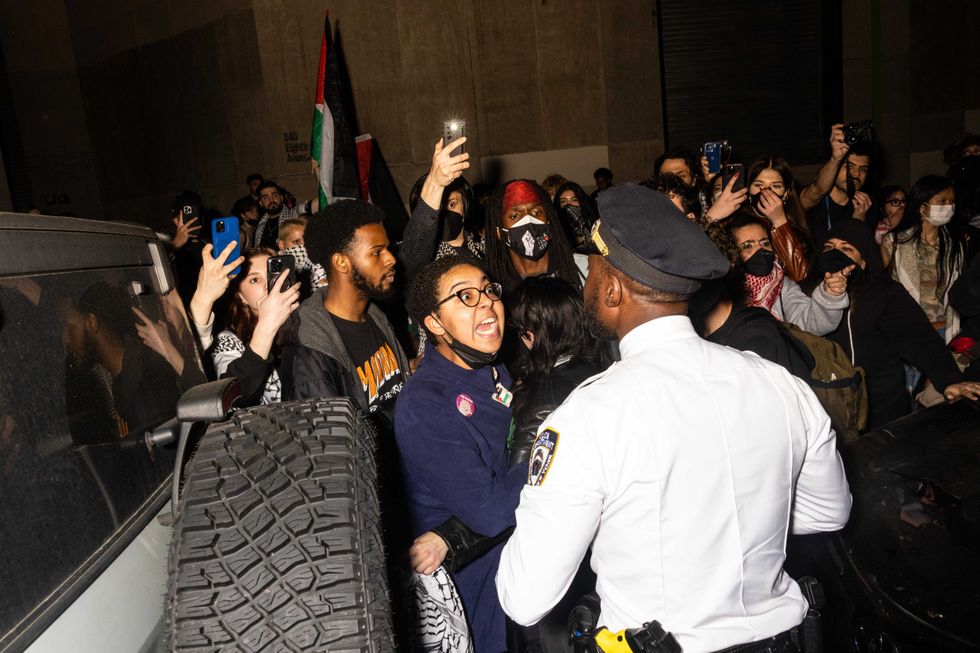 Police arrest demonstrators at a pro-Palestine encampment that was being cleared at the Fashion Institute of Technology on May 7, 2024