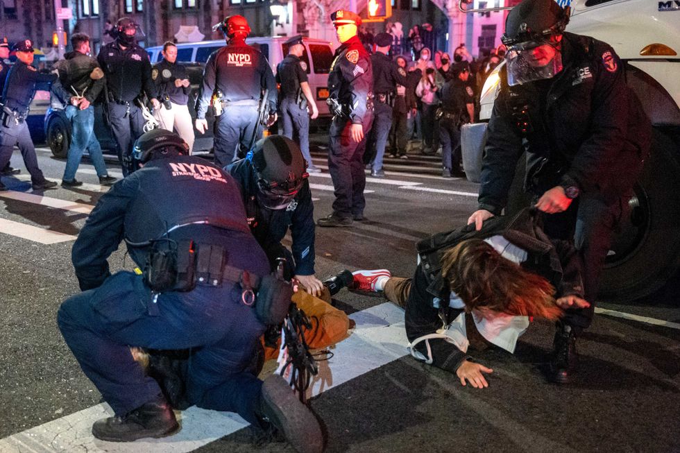 Police arrest protesters during pro-Palestinian demonstrations at The City College Of New York (CUNY) on April 30, 2024.