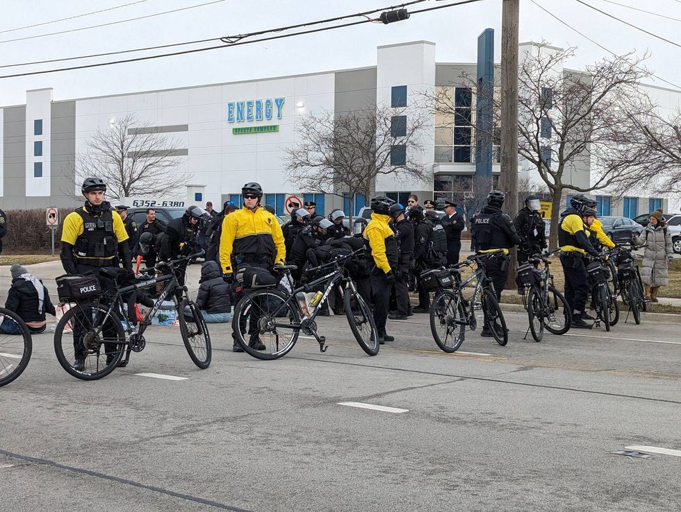 Police arrested protesters who blocked the entrance to a facility belonging to Woodward, a missile component manufacturer.