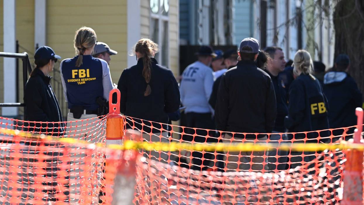 Police, ATF and FBI agents are seen outside of a house on Mandeville Street in New Orleans on Jan. 2, 2025