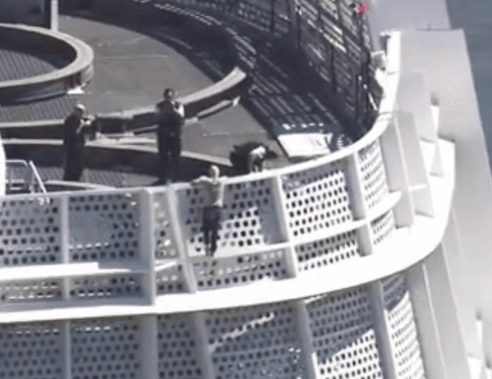 Police await the climber at the top of the 60-floor tower.