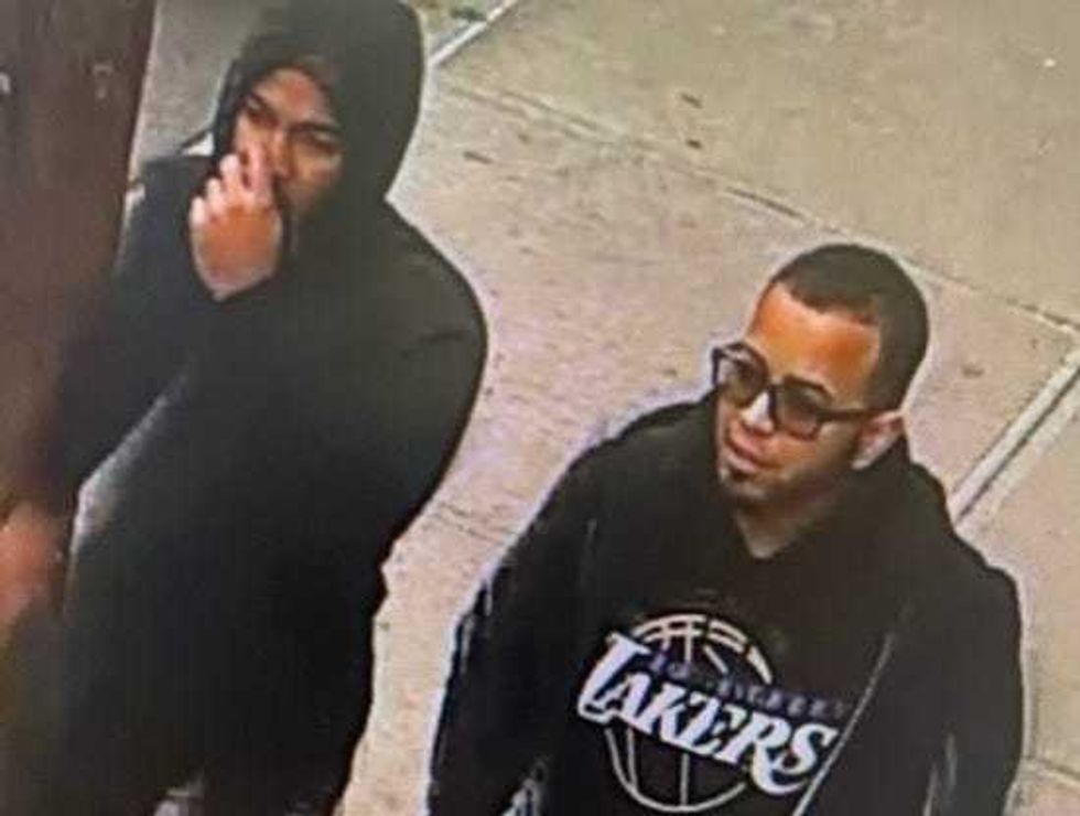 Police believe these two men acted as lookouts for the two men who entered the jewelry store