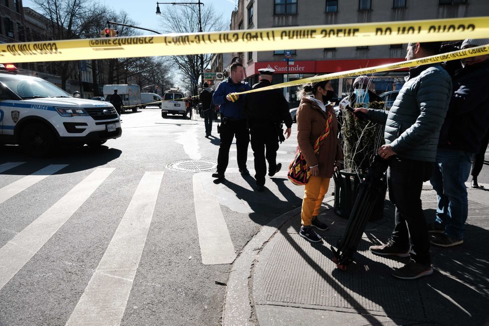 Police block off a street in Bay Ridge after a man drove a U-Haul truck into pedestrians on Feb. 13, 2023