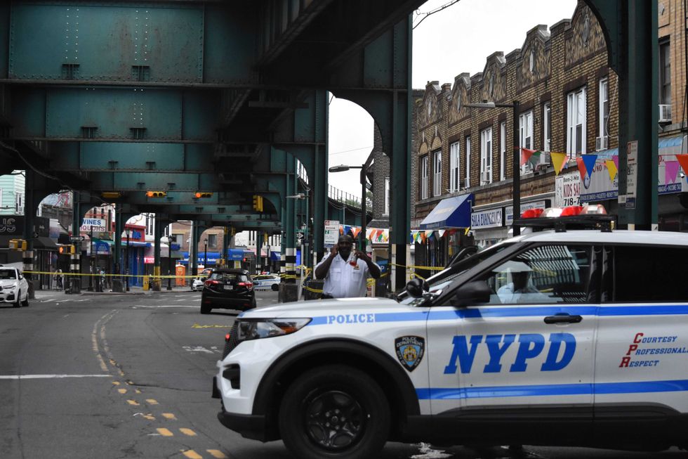 Police block the roadway where an 86-year-old man was fatally shot on Saturday in Richmond Hill