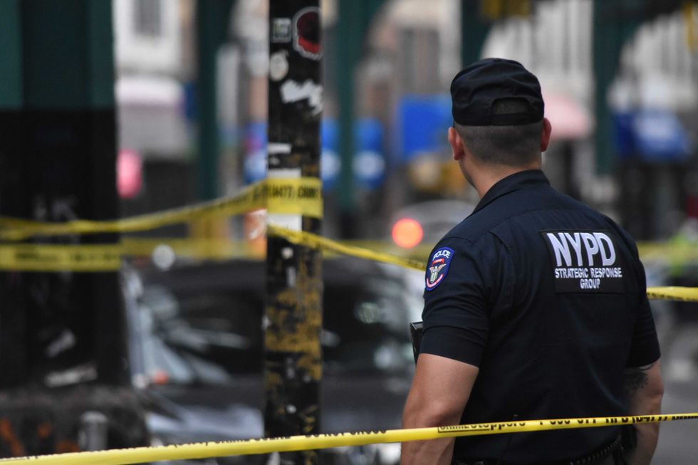 Police block the roadway where an 86-year-old man was fatally shot on Saturday in Richmond Hill