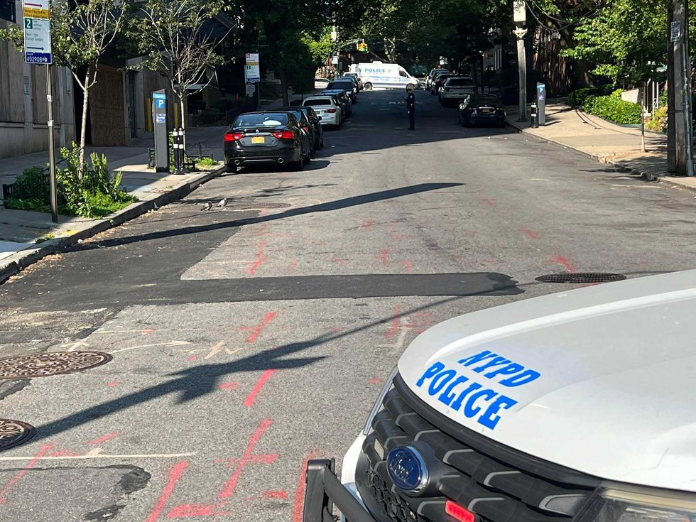 Police blocked off 82nd Road in Kew Gardens following the shooting Wednesday morning