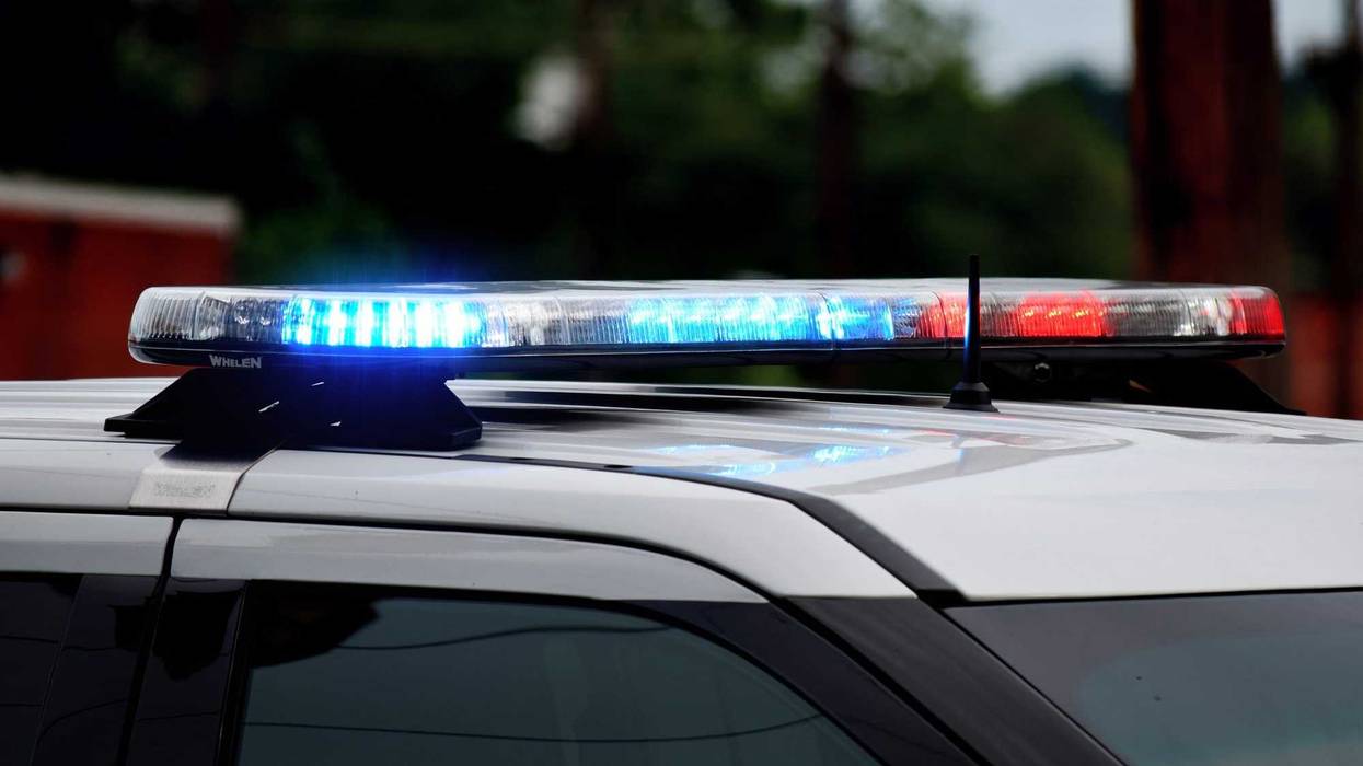 Police car flashing lights close up. Top of police car with flashing lights in daytime. Blue and red lights. Police at crime or accident scene.