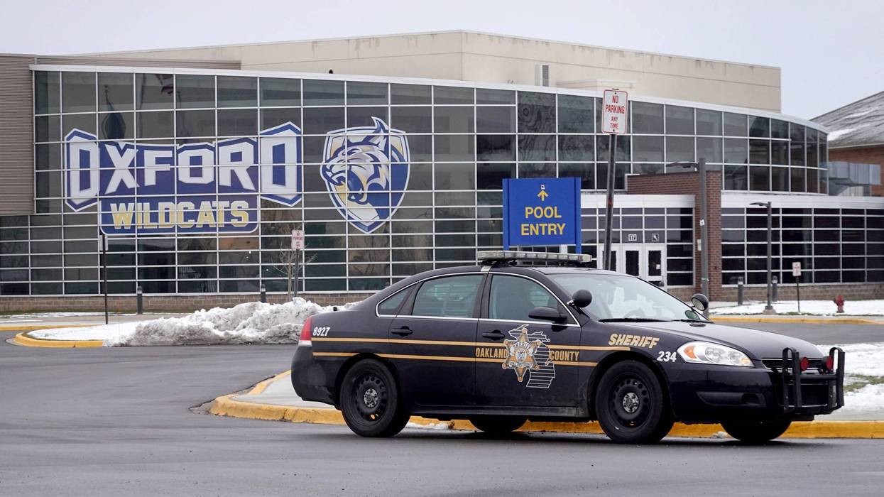 Police car in front of Oxford High School a day after deadly November 2021 shooting