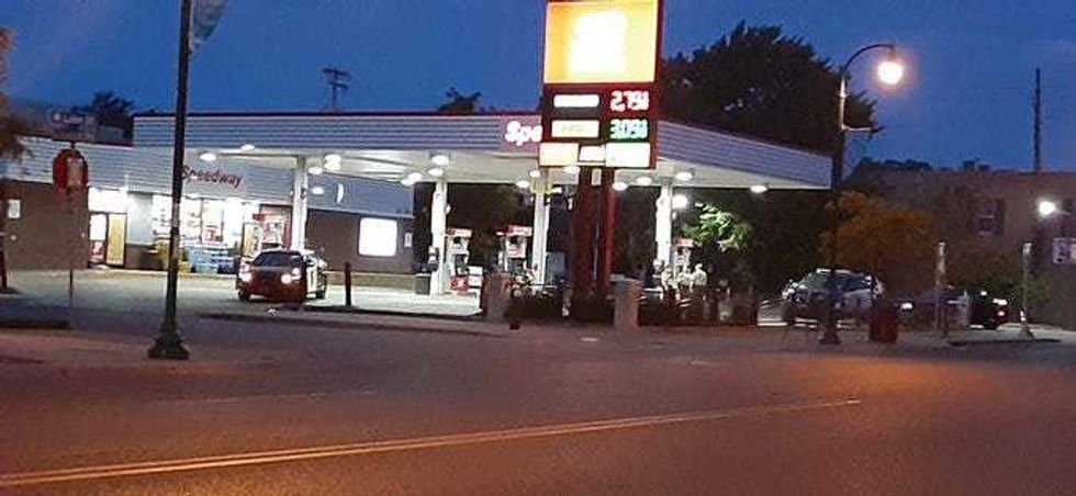 Police cars at ransacked gas station