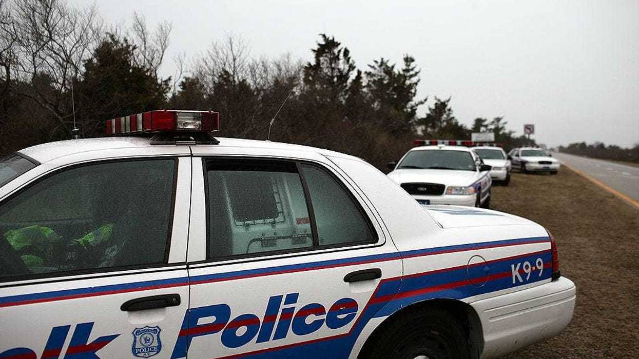 Police cars involved in the search effort sit on the side of the road along a stretch of beach highway on April 5, 2011 in Babylon, New York.