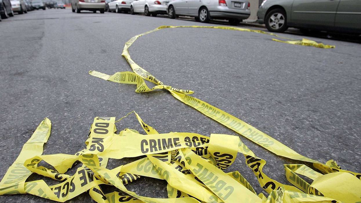 Police crime scene tape lies in the street outside Club Kalua club where Sean Bell was shot and killed November 28, 2006 in Jamaica, Queens, New York City. Sean Bell was killed and two friends wounded when New York City police fired 50 shots at them outside a strip club after Bell