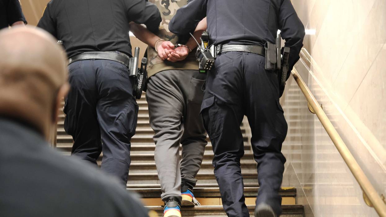 Police detain a man at a Times Square subway station following a call to police from riders on April 25, 2022 in New York City