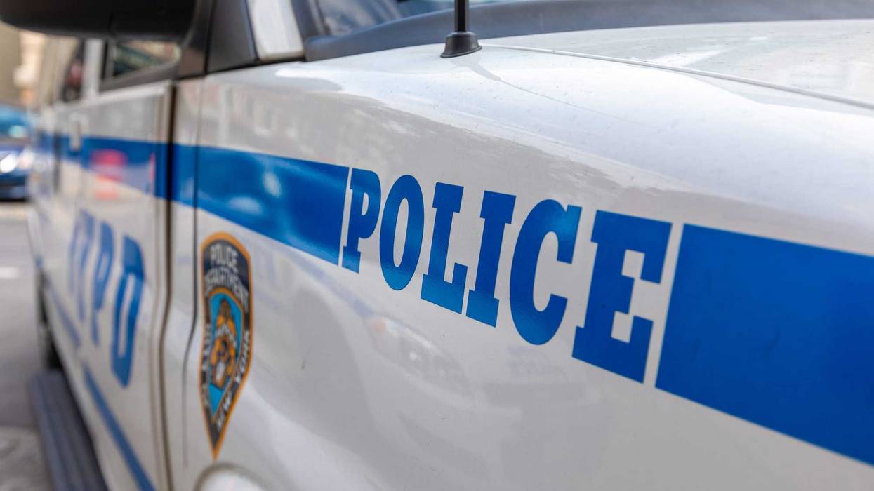 Police discovered a man's body in Queens Friday afternoon with a stab wound to the neck.