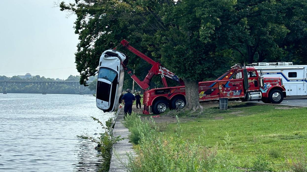Police dive crews pull the car out of the Schuylkill River, Aug. 28, 2024.
