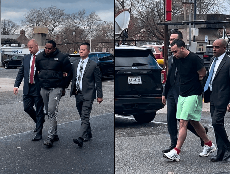 Police escort the two men on Thursday