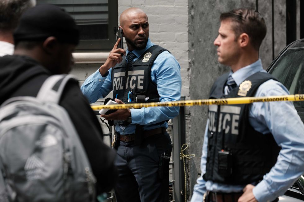 Police gather at the scene of a shooting in Brooklyn that left one person dead on June 16, 2022