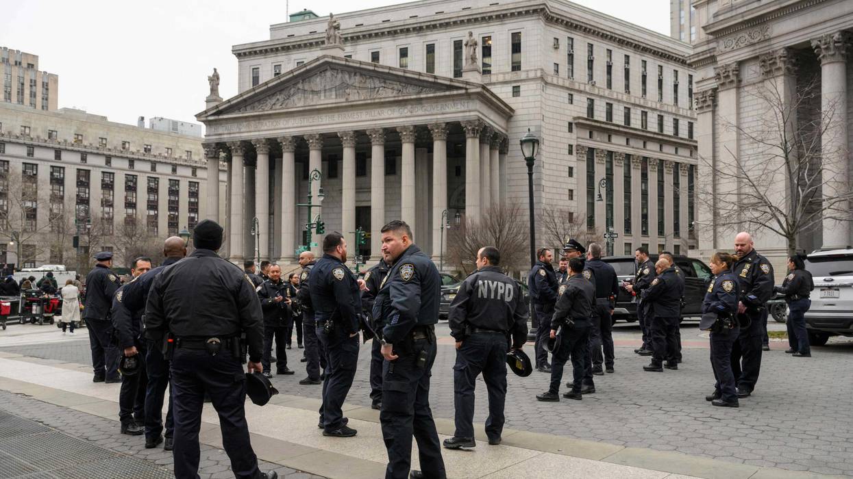 Police gather near the Manhattan Criminal Court and Manhattan District Attorney's Office in Lower Manhattan on March 22, 2023
