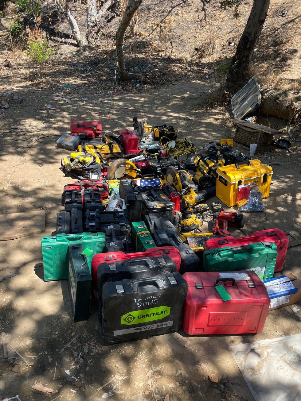 Police have arrested six suspects after finding a bunker full of stolen goods at a homeless encampment in San Jose.