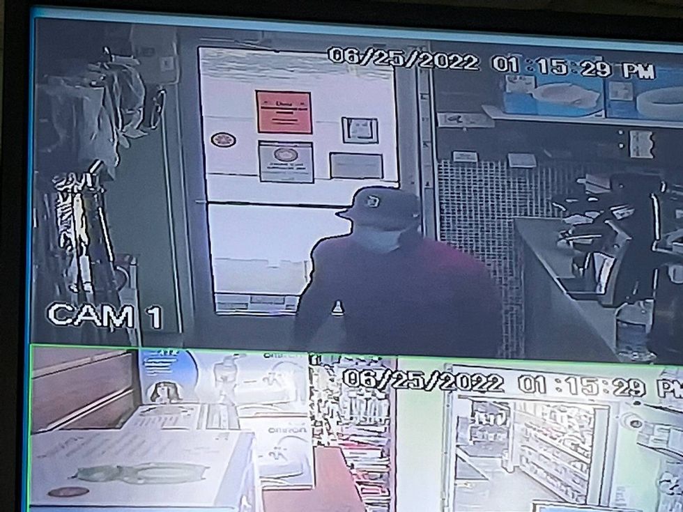 Police in Canton are on the hunt for a suspect they accuse of holding up a local pharmacy clerk at gunpoint and demanding pills and cash.