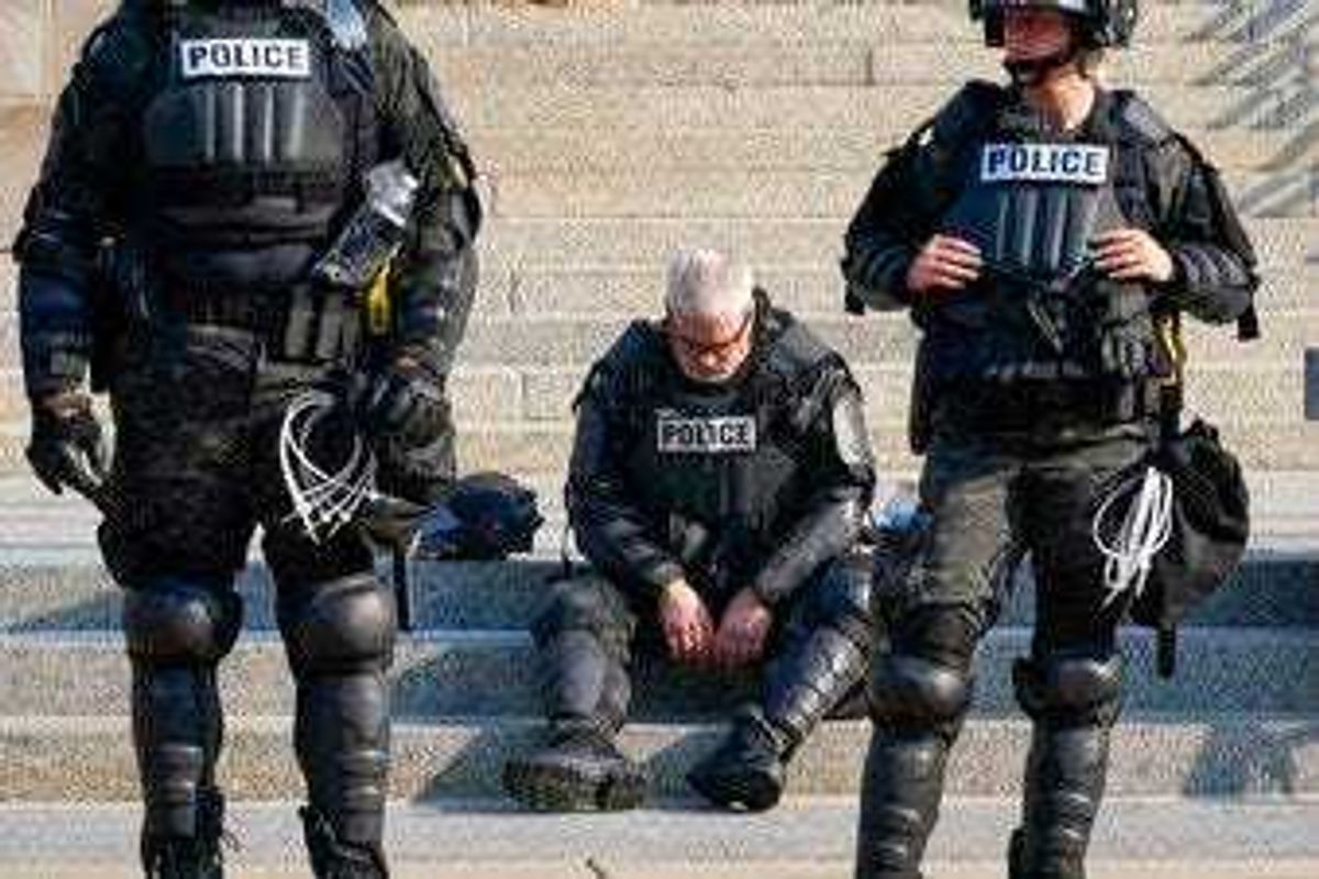 Police in riot gear stand outside the Kenosha County Court House Monday, Aug. 24, 2020, in Kenosha, Wis. Protests broke out late Sunday night after a police shooting. (AP Photo/Morry Gash)