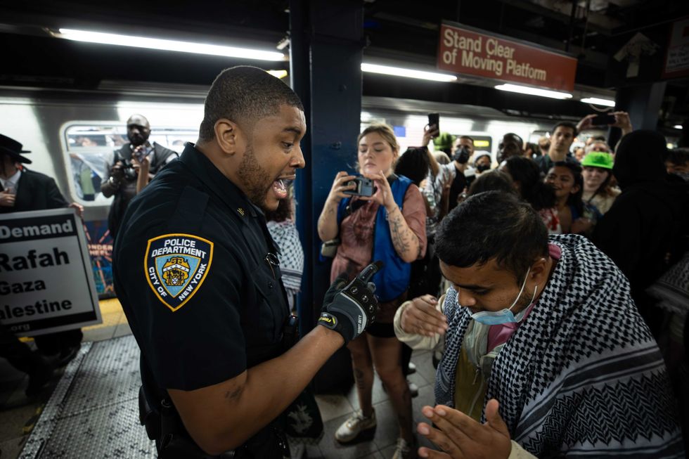 Police intervene inside the subway station as protesters gather at Union Square on June 10, 2024 in New York City.
