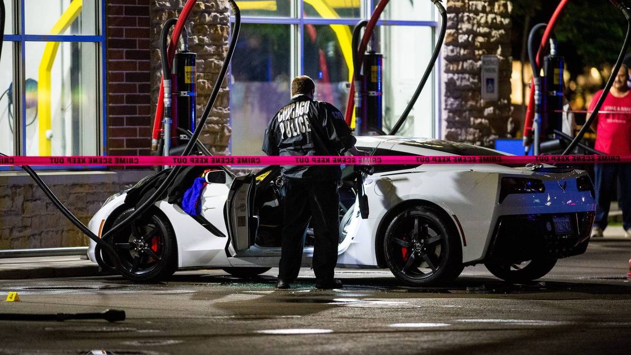 Police investigate a shooting at a vacuum stall of the Fuller’s Express $3 Car Wash at 2146 S. Rockwell St.