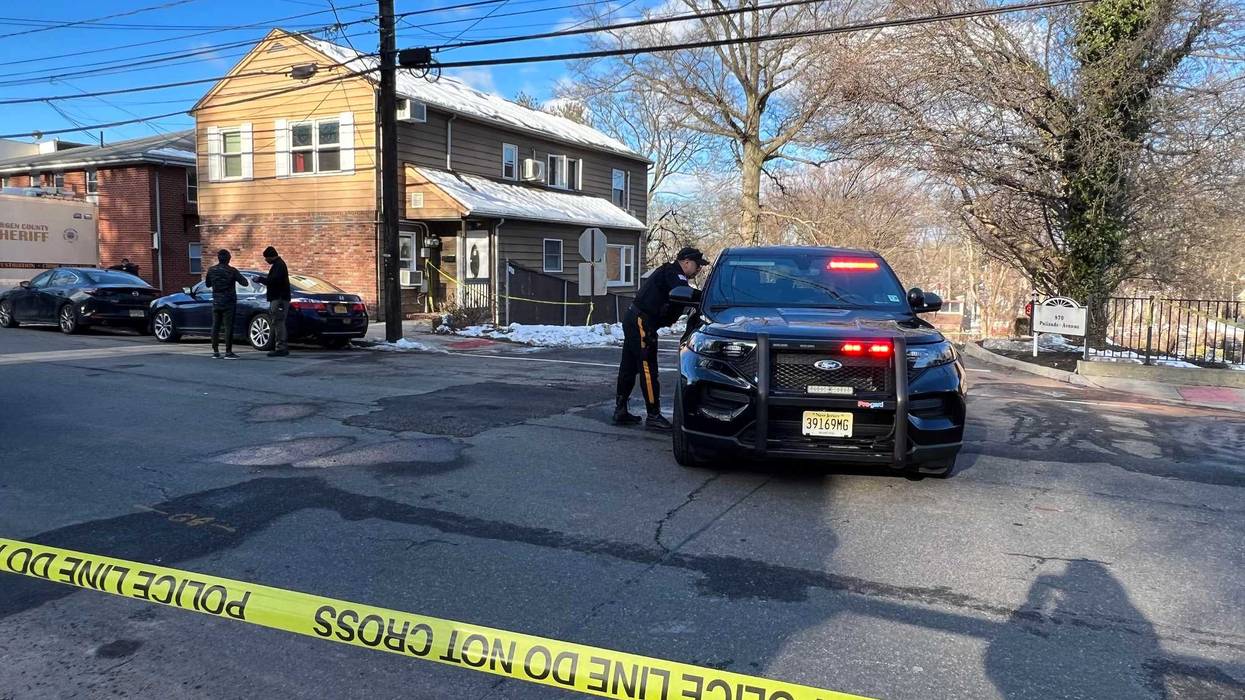 Police investigate after a house fire in Teaneck, New Jersey left multiple people, who were trapped in the basement, injured early Monday morning.