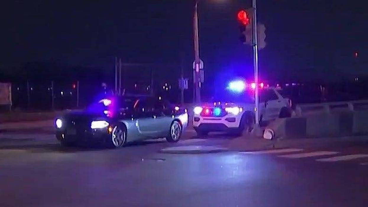 Police investigate an undercover officer's car after it was shot by an unknown assailant last week. The officer was injured by glass and treated at a hospital.