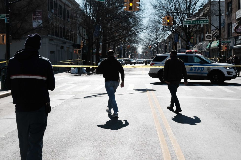 Police investigate at an intersection after a man driving a U-Haul truck struck several pedestrians in the Bay Ridge neighborhood of Brooklyn on Feb. 13, 2023