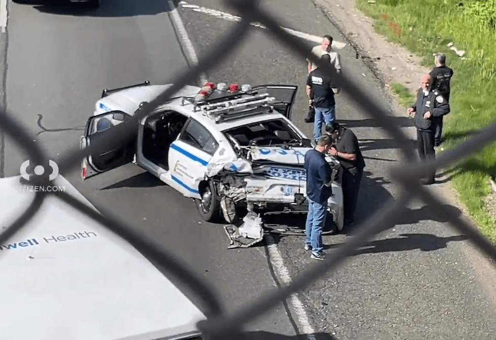 Police investigate at the crash scene on Thursday morning