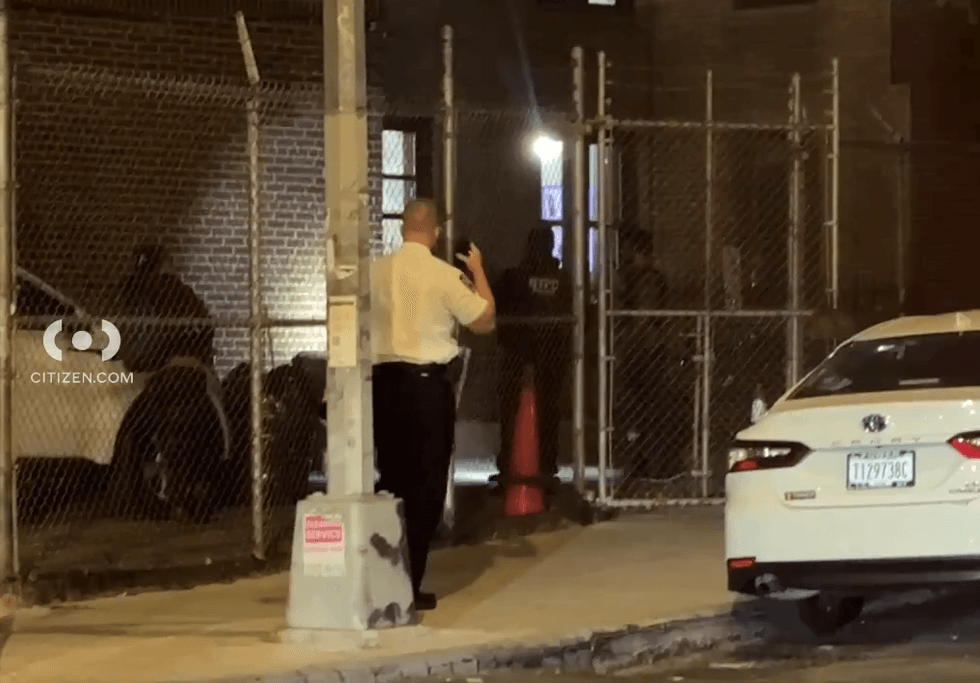 Police investigate at the scene a couple blocks from the Bronx Zoo