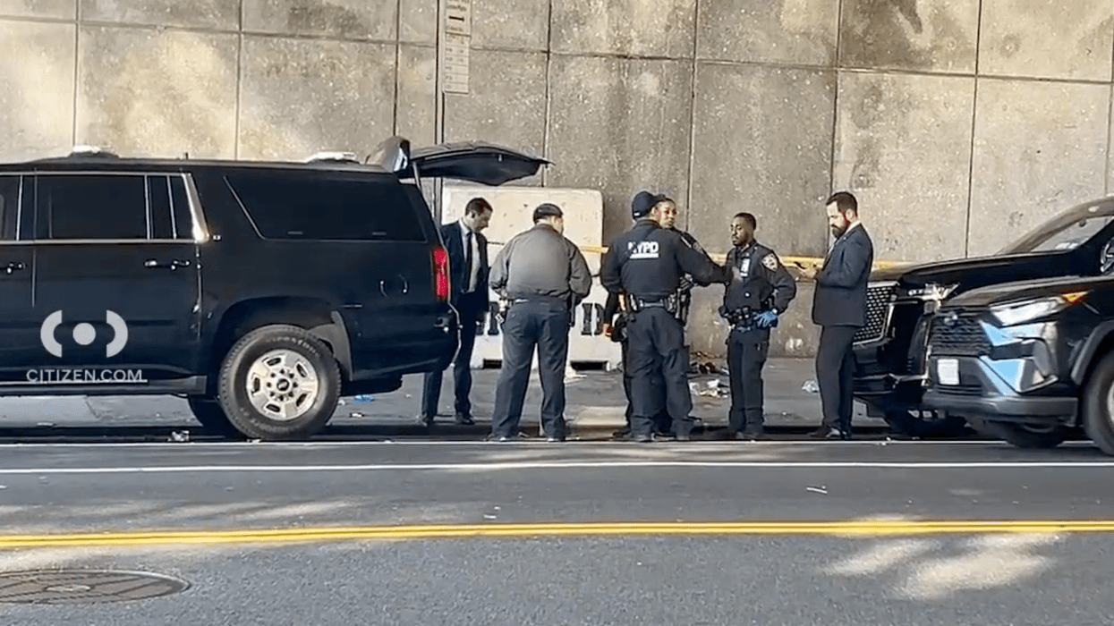 Police investigate at the scene in Tutor City where a woman was stabbed Monday morning