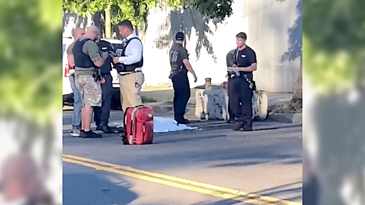 Police investigate at the scene of a fatal shooting in Far Rockaway on Monday evening