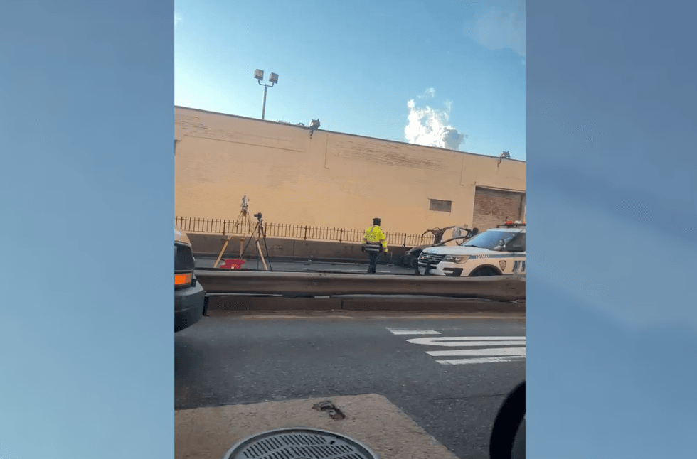 Police investigate at the scene of the crash at daybreak
