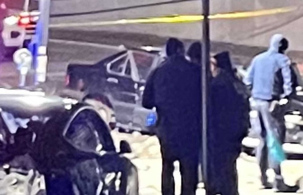 Police investigate at the scene of the officer-involved shooting