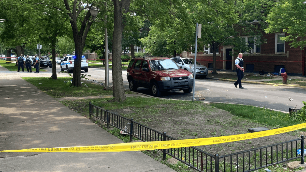 Police investigate at the site of a mass shooting Wednesday, July 14 in the 7800 block of South Bishop Street.
