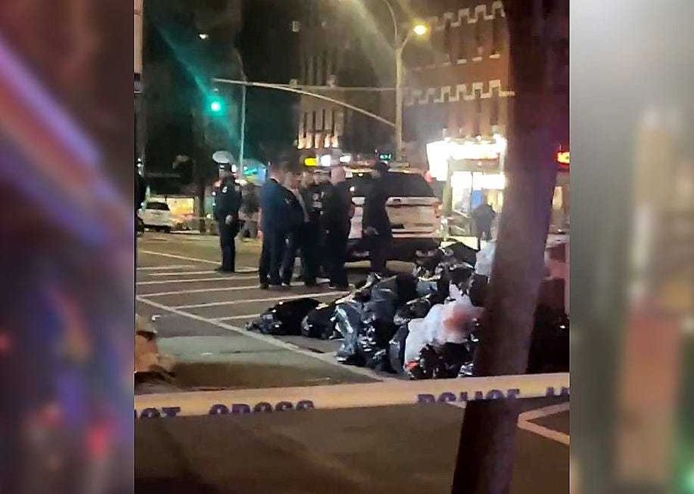 Police investigate outside the smoke shop on Ninth Avenue early Wednesday morning