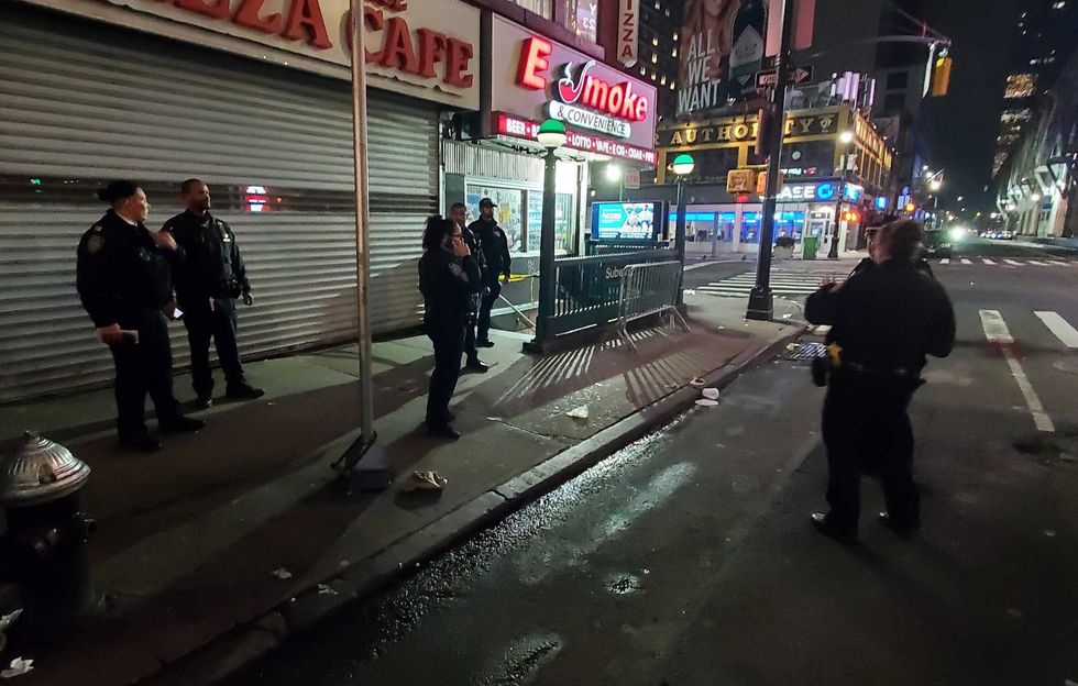 Police investigate outside the Times Square–42nd Street/Port Authority subway station after an attack early Tuesday