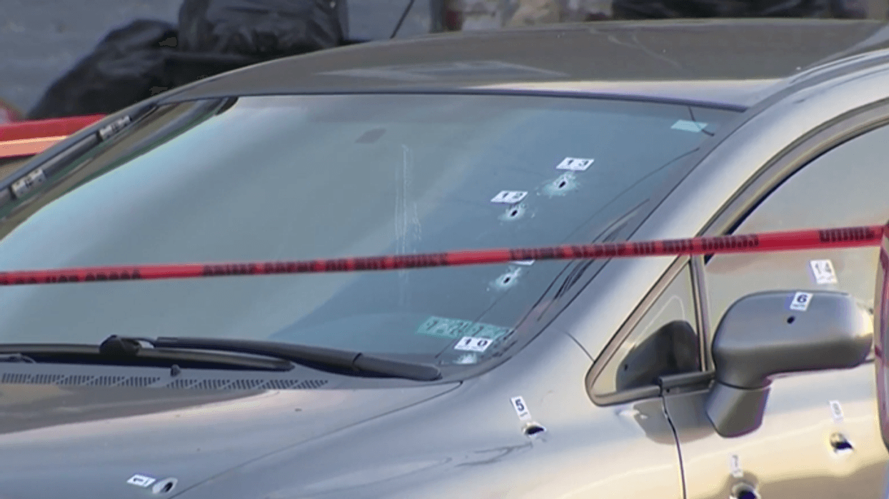Police investigating after a woman was shot and killed in her car