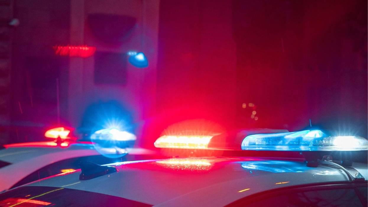 Police lights outside a building at night